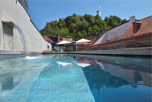 Joined old town houses standing above the river at Vander Urbani Resort, Ljubljana, Slovenia
